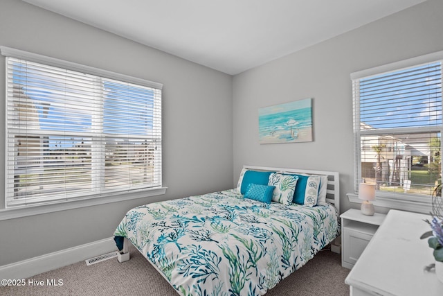 bedroom featuring carpet, visible vents, and baseboards