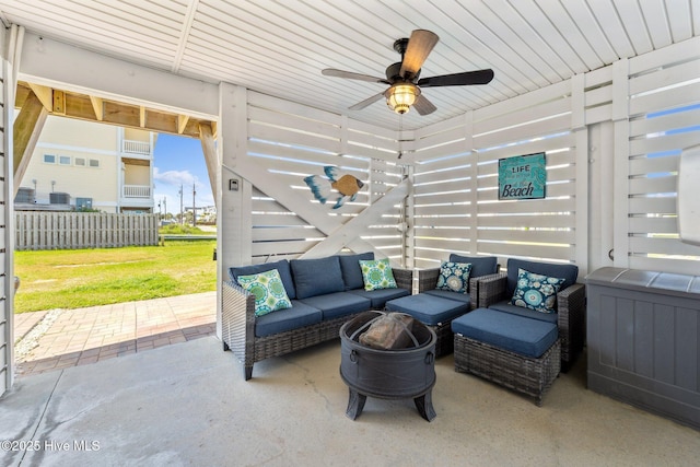 view of patio / terrace featuring an outdoor hangout area, a ceiling fan, and fence