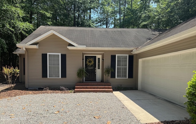 1735 W Pennsylvania Ave, Southern Pines, NC 28387 - ranch-style home with driveway, a garage, and a shingled roof