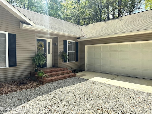 1735 W Pennsylvania Ave, Southern Pines, NC 28387 - entrance to property with a garage, driveway, and a shingled roof