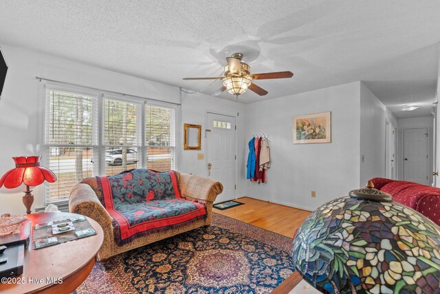 1 Vail Pl, Pinehurst, NC 28374 - living room with light wood finished floors, baseboards, and a ceiling fan