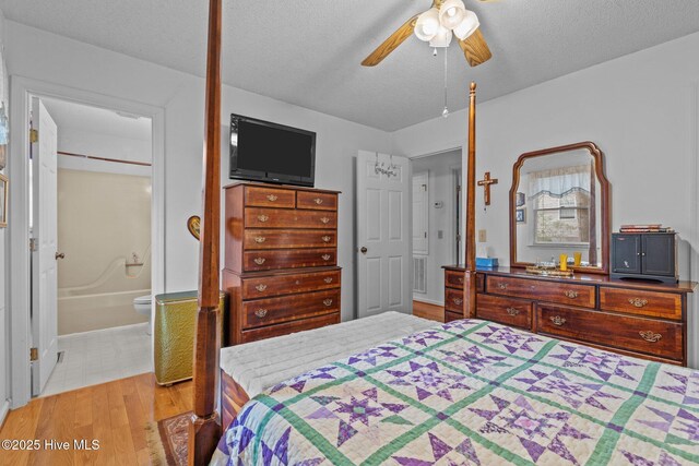 1 Vail Pl, Pinehurst, NC 28374 - full bathroom with toilet, vanity, a textured ceiling, and shower / bathtub combination with curtain