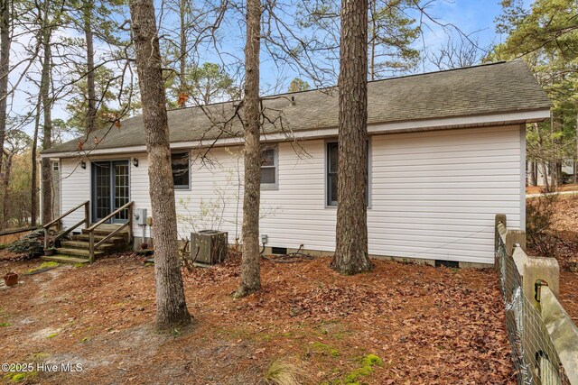 1 Vail Pl, Pinehurst, NC 28374 - back of house with entry steps, a shingled roof, and central AC