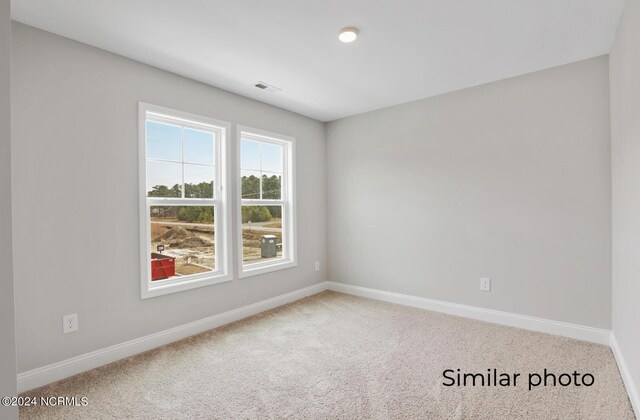 157 Loren Rd, Hubert, NC 28539 - unfurnished room featuring carpet floors, baseboards, and visible vents