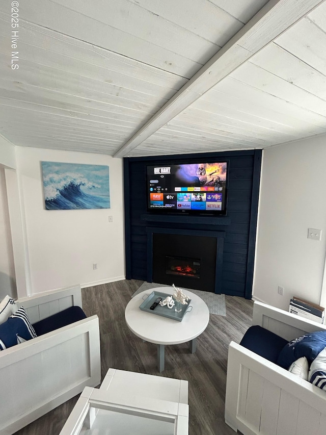 living area with wood finished floors, wood ceiling, and a lit fireplace