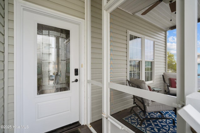 exterior space featuring a ceiling fan and a residential view