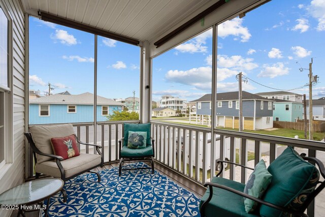 1317 Bowfin Ln Unit 2, Carolina Beach, NC 28428 - sunroom featuring a residential view and plenty of natural light