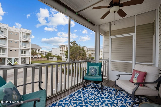 1317 Bowfin Ln Unit 2, Carolina Beach, NC 28428 - sunroom / solarium with ceiling fan and a residential view