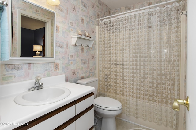 bathroom featuring toilet, tile patterned floors, wallpapered walls, and vanity