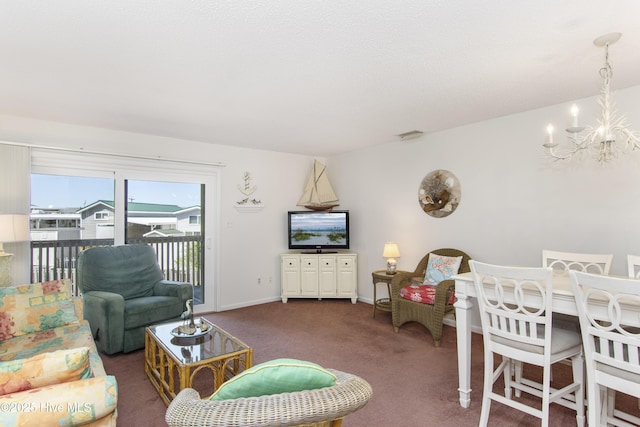 living area with an inviting chandelier, baseboards, and carpet