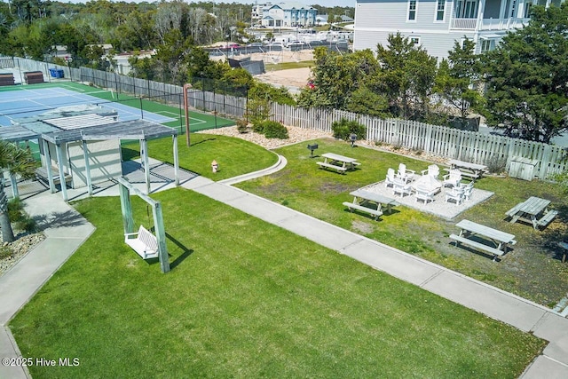 view of property's community featuring fence