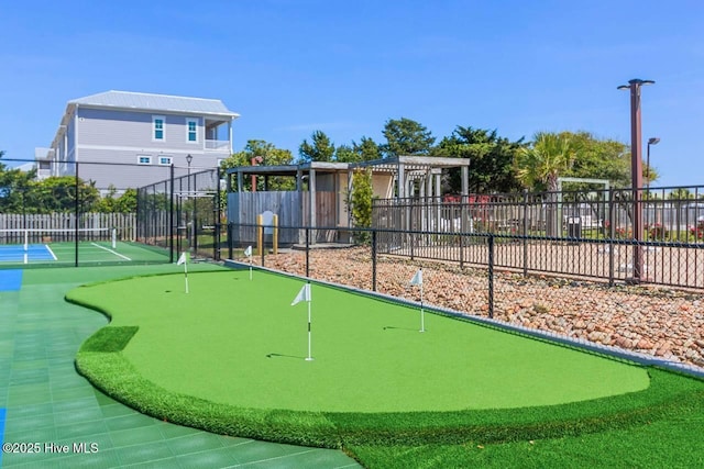 view of home's community featuring fence