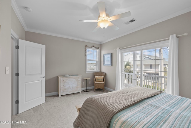 carpeted bedroom with crown molding, visible vents, ceiling fan, and baseboards