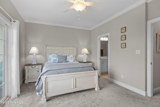 bedroom featuring ensuite bath, crown molding, carpet flooring, and baseboards