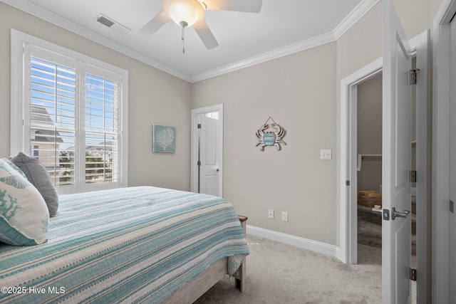 carpeted bedroom featuring crown molding, visible vents, ceiling fan, and baseboards