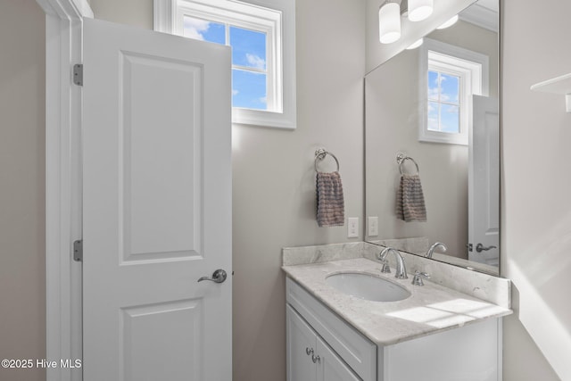 bathroom with a wealth of natural light and vanity