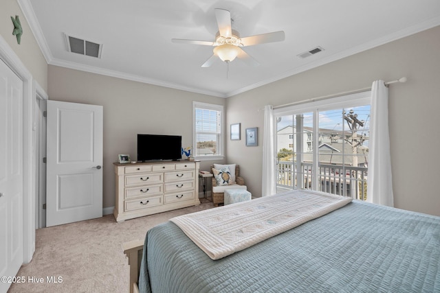 bedroom featuring visible vents, crown molding, and carpet flooring