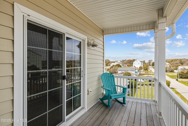 wooden deck with a residential view