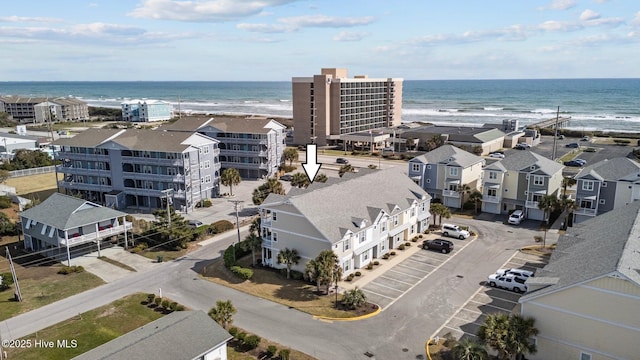 birds eye view of property featuring a water view and a view of the beach