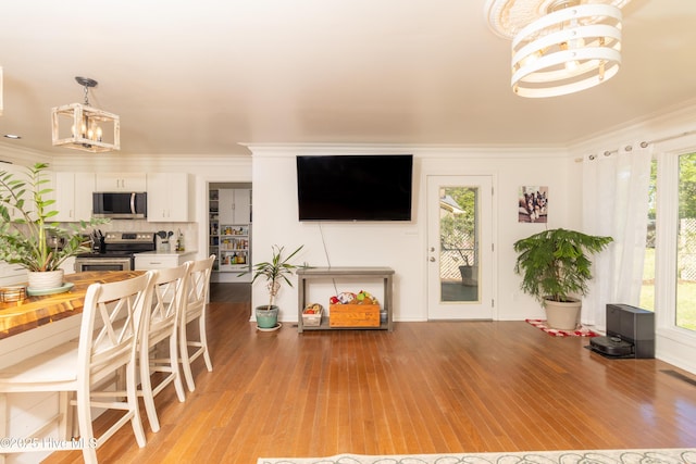 206 Robin Ln, Edenton, NC 27932 - dining space featuring a chandelier, light wood-style flooring, and crown molding