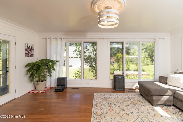 206 Robin Ln, Edenton, NC 27932 - living room with wood finished floors, healthy amount of natural light, baseboards, and ornamental molding