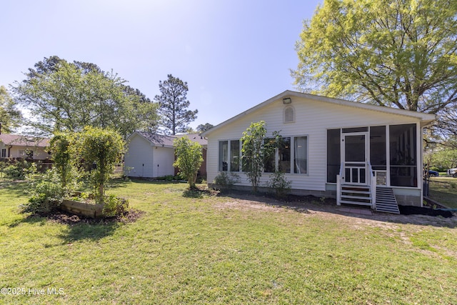 206 Robin Ln, Edenton, NC 27932 - back of house featuring a sunroom and a yard