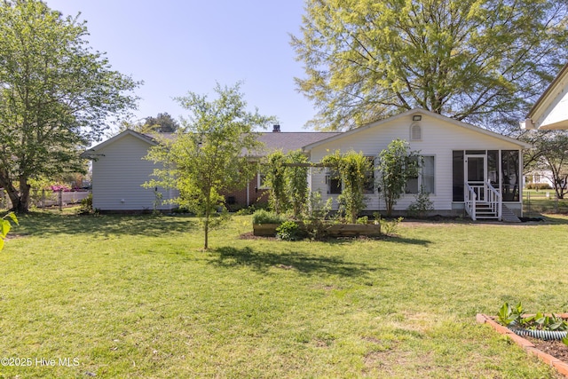 206 Robin Ln, Edenton, NC 27932 - back of house featuring a sunroom and a lawn