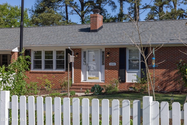 206 Robin Ln, Edenton, NC 27932 - view of front of home featuring brick siding, a shingled roof, and a chimney