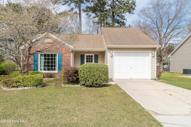 single story home with roof with shingles, concrete driveway, brick siding, a front lawn, and a garage