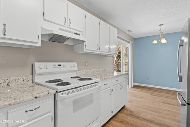 kitchen featuring under cabinet range hood, a textured ceiling, electric range, freestanding refrigerator, and white cabinets