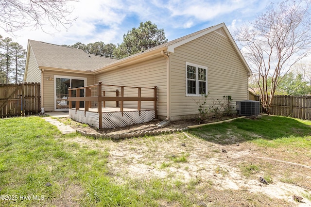 back of house with a yard, fence, central AC unit, and a deck