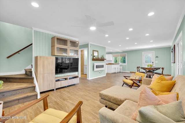 living room featuring ornamental molding, stairway, light wood-type flooring, recessed lighting, and a ceiling fan