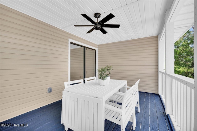 sunroom / solarium featuring ceiling fan