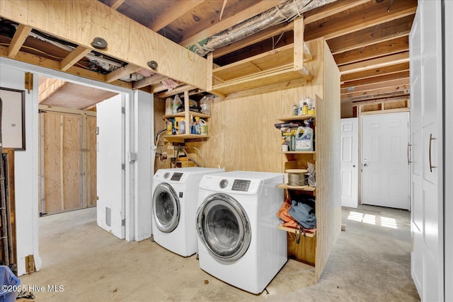 washroom featuring separate washer and dryer and laundry area