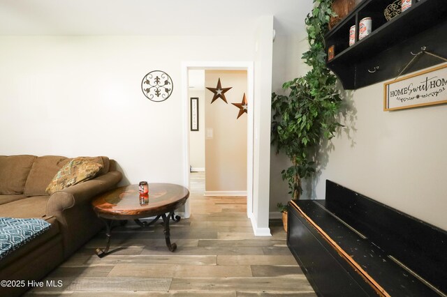 304 Sheffield Rd, Jacksonville, NC 28546 - living room featuring baseboards and wood finished floors
