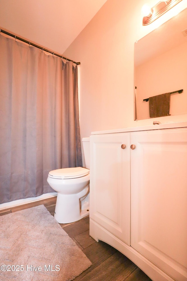 304 Sheffield Rd, Jacksonville, NC 28546 - full bathroom featuring toilet, a shower with shower curtain, and wood finished floors