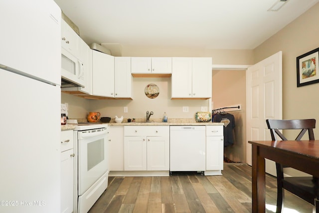 304 Sheffield Rd, Jacksonville, NC 28546 - kitchen featuring white appliances, a sink, visible vents, white cabinets, and wood finished floors