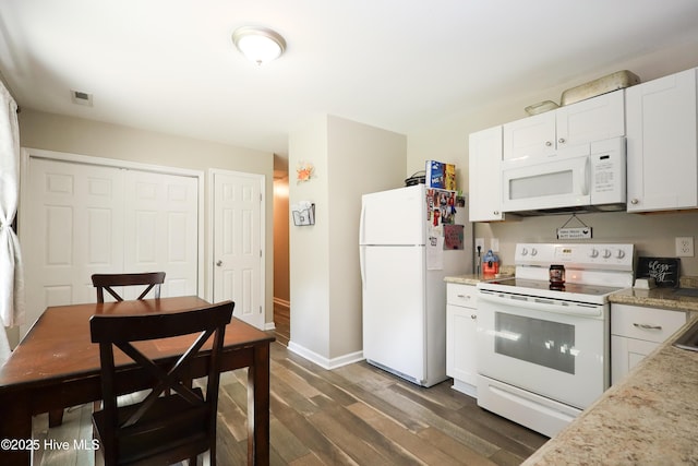 304 Sheffield Rd, Jacksonville, NC 28546 - kitchen featuring white cabinetry, dark wood finished floors, baseboards, white appliances, and visible vents