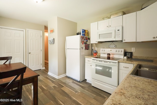 304 Sheffield Rd, Jacksonville, NC 28546 - kitchen with light countertops, white cabinetry, baseboards, white appliances, and dark wood-type flooring