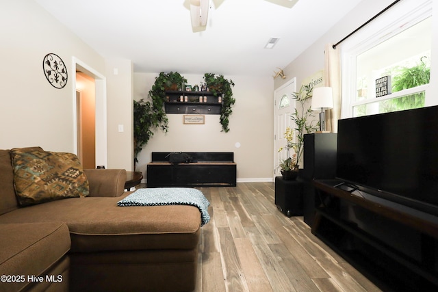 304 Sheffield Rd, Jacksonville, NC 28546 - living room with visible vents, baseboards, and wood finished floors
