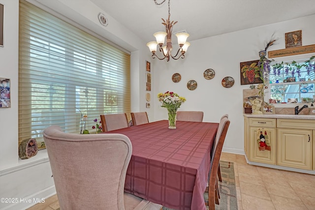7001 Robert Ruark Dr SE, Southport, NC 28461 - dining space featuring a chandelier and light tile patterned floors