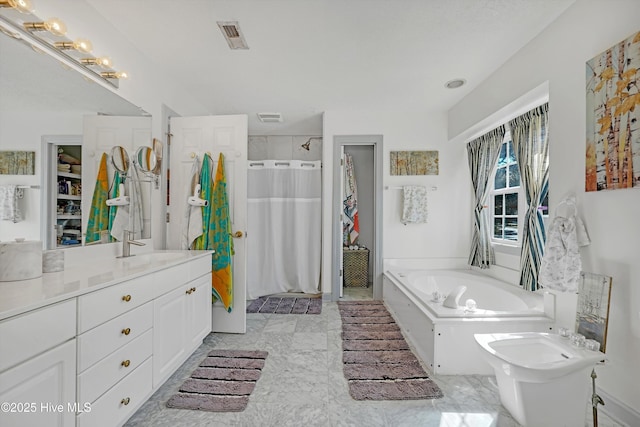 7001 Robert Ruark Dr SE, Southport, NC 28461 - full bathroom featuring a shower with curtain, vanity, a bath, marble look tile flooring, and a bidet