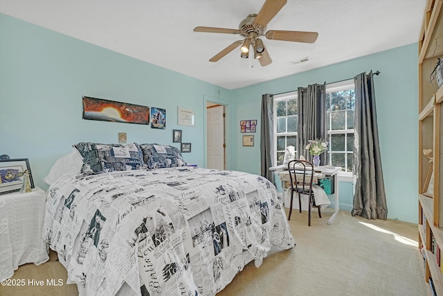 7001 Robert Ruark Dr SE, Southport, NC 28461 - bedroom with light carpet and ceiling fan