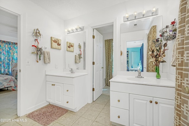 7001 Robert Ruark Dr SE, Southport, NC 28461 - bathroom with two vanities and tile patterned floors