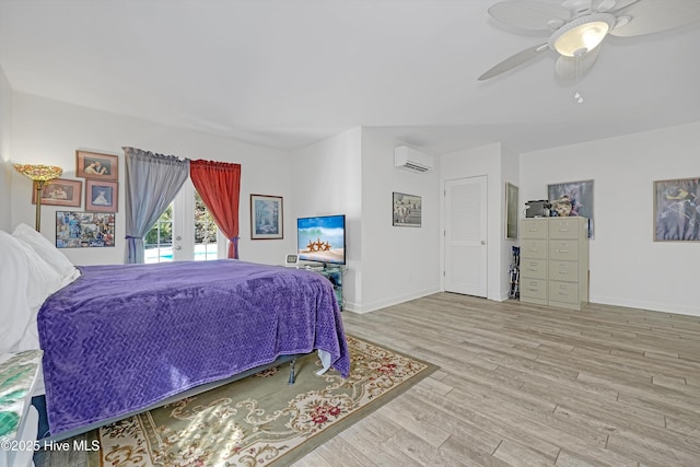 7001 Robert Ruark Dr SE, Southport, NC 28461 - bedroom with a wall mounted AC, wood finished floors, a ceiling fan, and access to outside