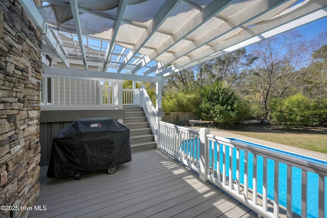 7001 Robert Ruark Dr SE, Southport, NC 28461 - wooden deck with stairway, a pergola, and grilling area