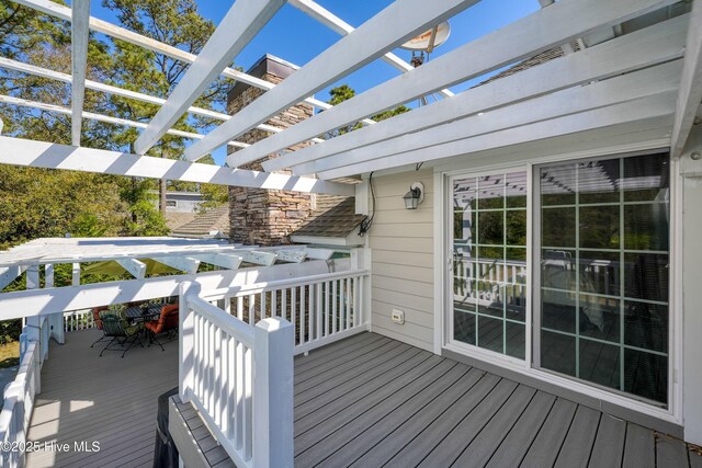 7001 Robert Ruark Dr SE, Southport, NC 28461 - wooden terrace with a pergola