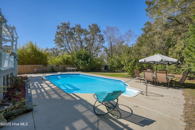 7001 Robert Ruark Dr SE, Southport, NC 28461 - view of pool featuring a patio, a fenced backyard, and view of scattered trees