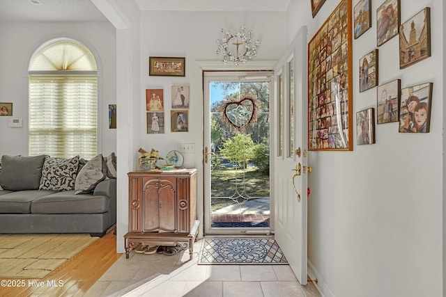 7001 Robert Ruark Dr SE, Southport, NC 28461 - foyer with light tile patterned flooring and baseboards