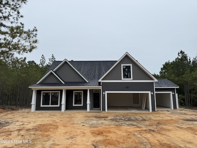 2746 County Line Rd, Cameron, NC 28326 - craftsman inspired home with a shingled roof and covered porch